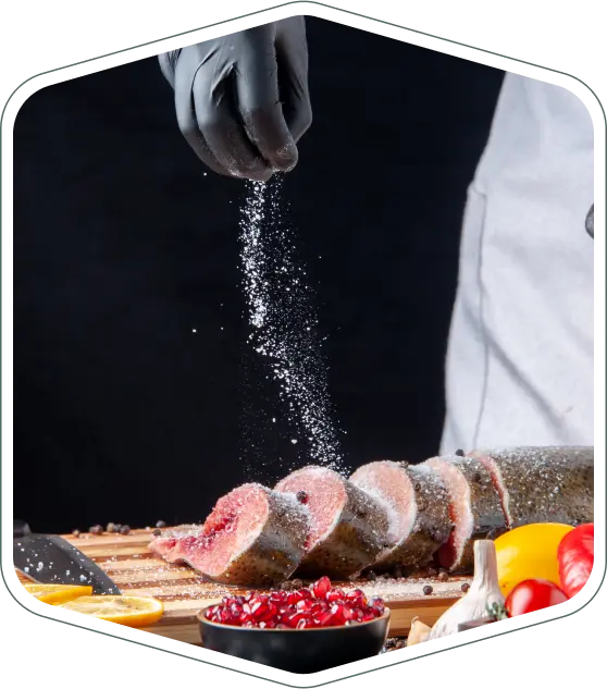 Fish portions being seasoned